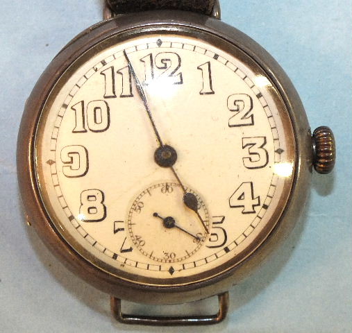 A Continental trench-type wrist watch, the white face with Arabic numerals and seconds subsidiary,