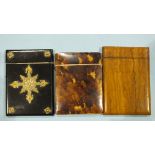A tortoiseshell card case, a sandal-wood card case and another, brass mounted papier-mâché card