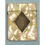 A Victorian mother of pearl and silver card case with central engraved silver lozenge inset.