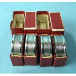 A set of four engine-turned napkin rings, Birmingham 1939, in boxes, ___1oz.