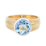 Ring mit einem Aquamarin, ca. 2,5ct,rund facettiert, D: ca. 9,5 mm, GG / WG 14K, RW 64, min.