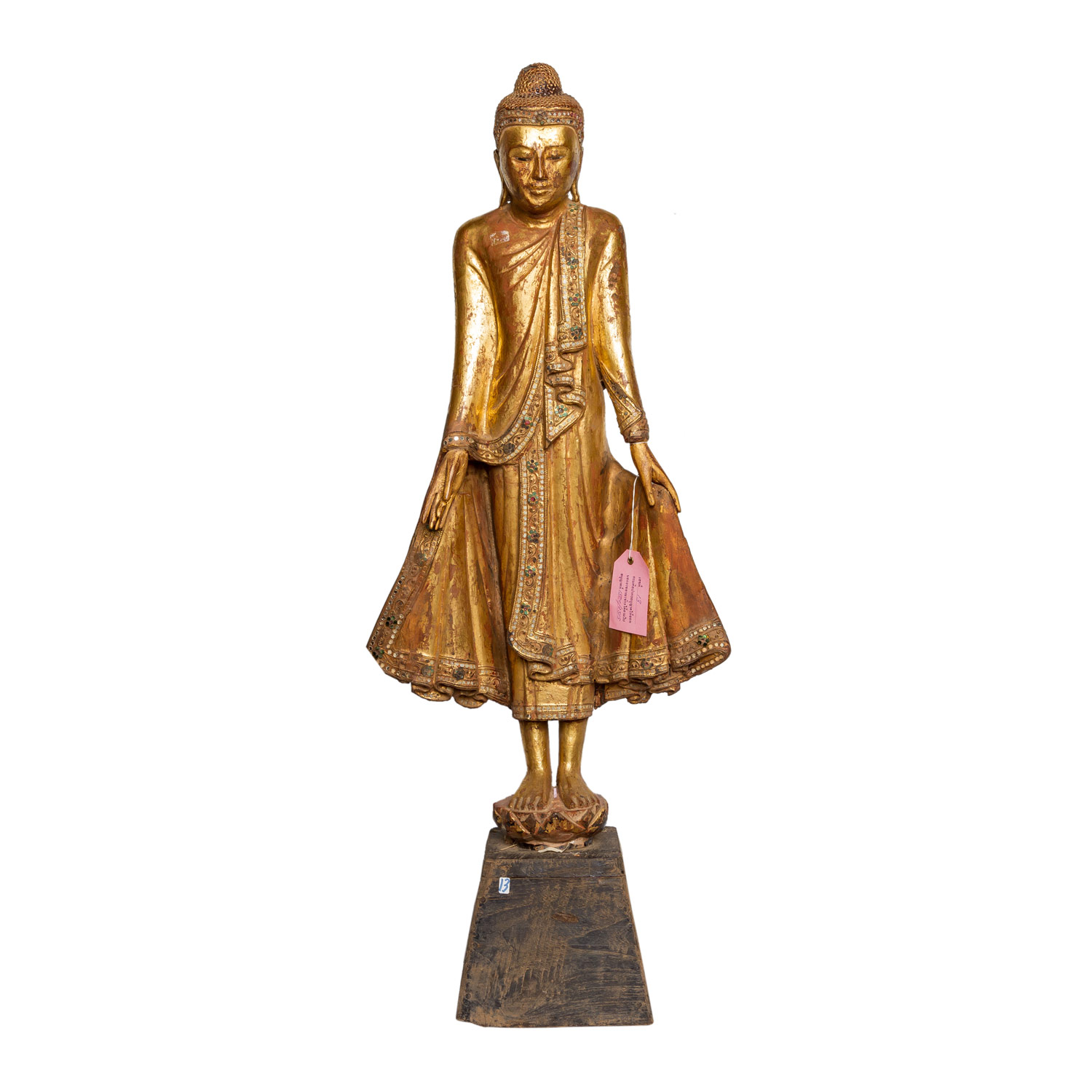 Holzfigur des stehenden Buddha. THAILAND, 20. Jh..Auf einem kleinen Sockel stehend, H 76 cm.