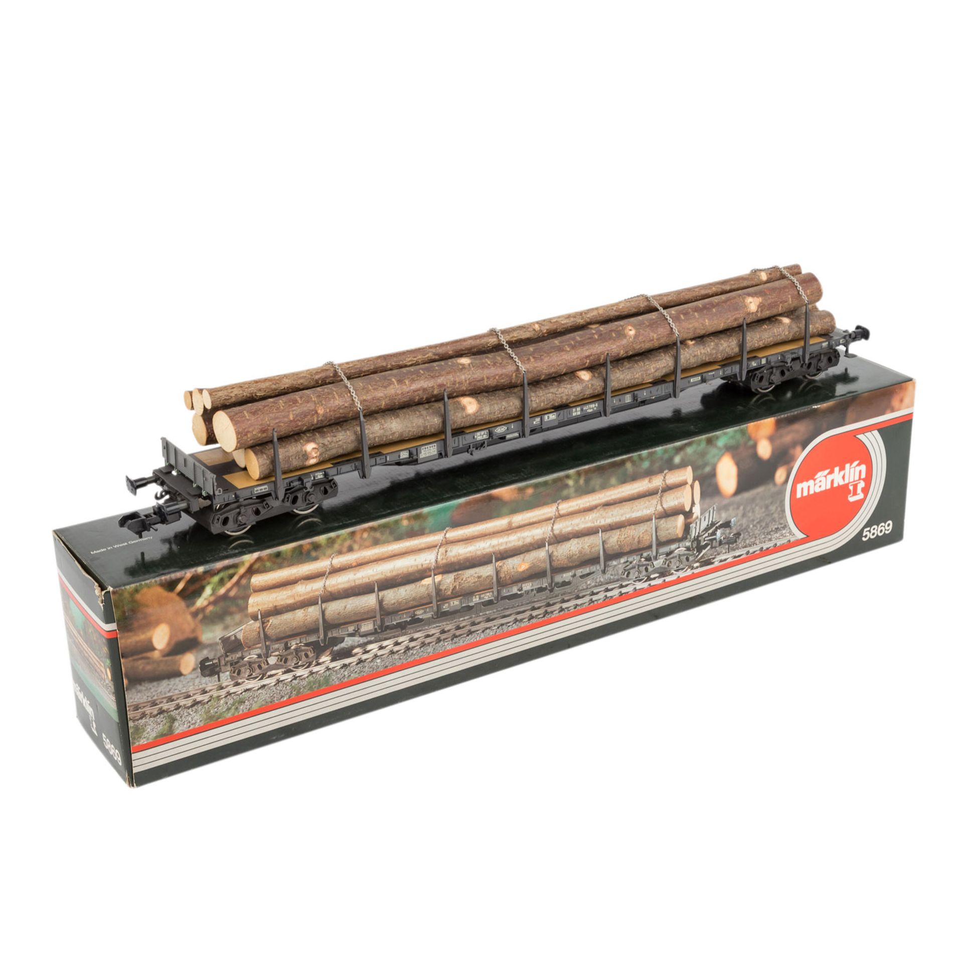 MÄRKLIN Rungenwagen 5869, Spur 1,mit Stammholzbeladung, Orig.-karton anbei (mit Altersspuren),