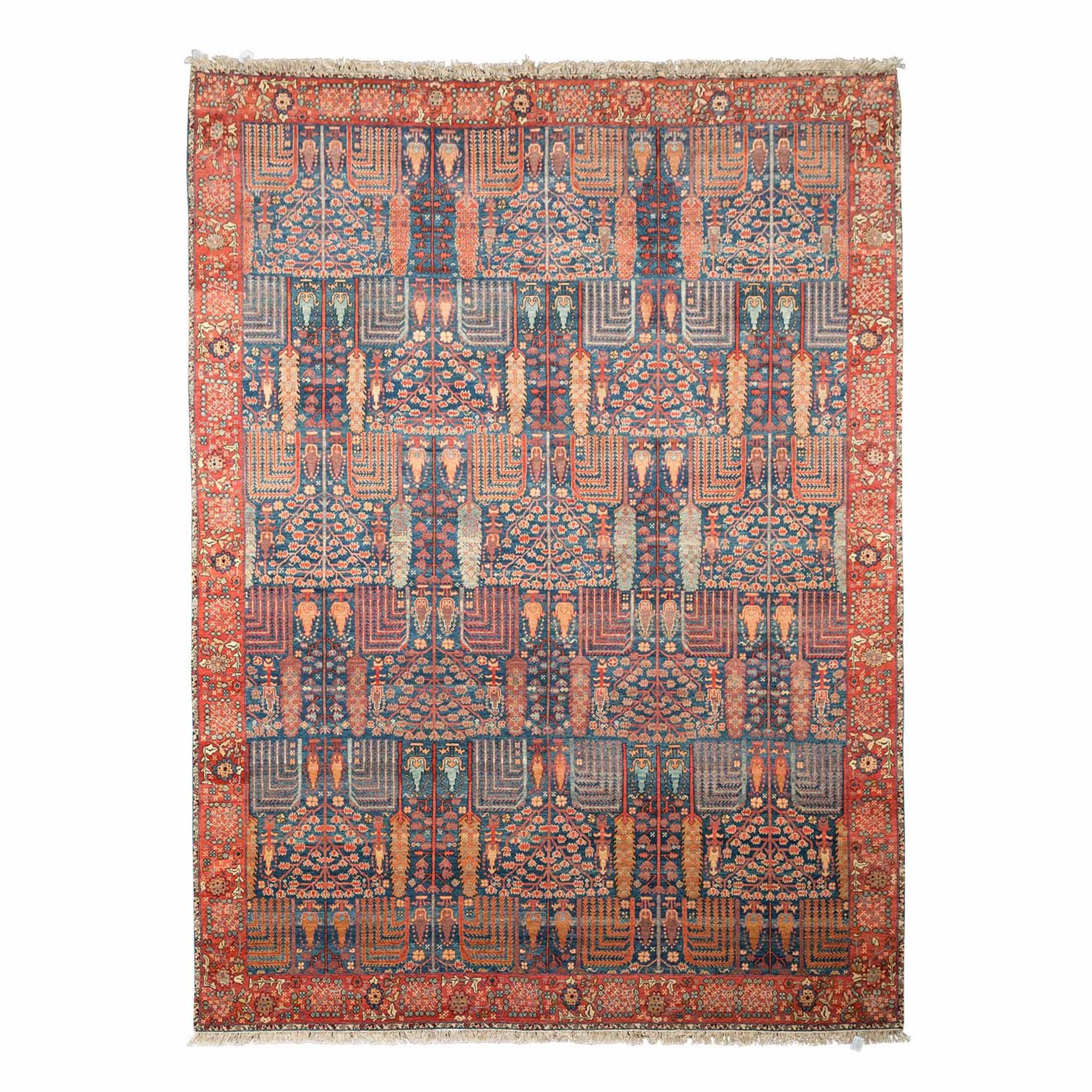 Moderner Orientteppich. KARACHI/PAKISTAN, 21. Jh., 360x268 cm.Der indigoblaue Fond des Innenfeldes