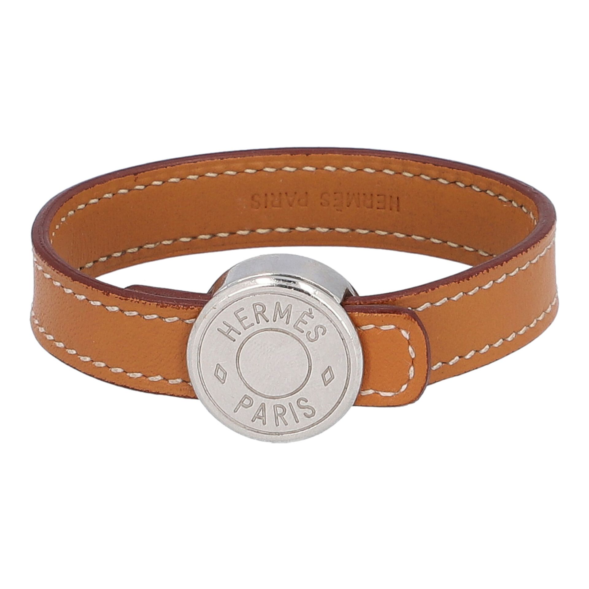 HERMÈS Armband "LOOPING", Koll. 2007.NP. ca.: 365,-€. Swift Leder in Cognacfarben, silberfarbene