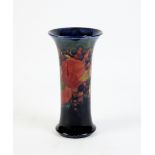 Moorcroft William, a pomegranate pattern trumpet vase with pattern of fruit and leaves on a deep