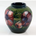 Moorcroft pink and blue anemone pattern, green ground squat ovoid vase, paper label and impressed