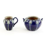 Royal Doulton sugar bowl and cream jug with Art Nouveau style tube lined decoration, jug 8.5 cm .