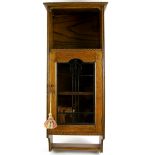 Early 20th C, Oak wall cabinet in the manner of Ambrose Heal, checkerboard ebony inlay, and part