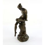 Early 20th C bronze figure of a nude maiden sitting on a rock, unsigned, height 18.5 cm.