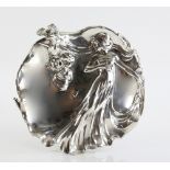 Silvered metal platter depicting a maiden with flowing hair and dress, in Art Nouveau style,