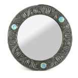 Early 20th C pewter mirror with decoration of stylised flowers and three Ruskin ceramic roundels .