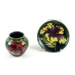 Moorcroft pottery hibiscus pattern, green ground small ovoid vase, paper label to base, 7.5cm