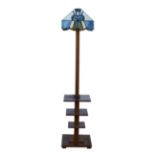 Art Deco walnut standard lamp with tiered base, and leaded glass shade, 153cm high. Good