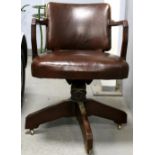 Art Deco desk chair, on four section mahogany base, reupholstered in brown leather, labelled with