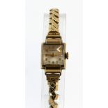 A Record Ladies 9 carat gold cased wristwatch the oval case congaing a honeycomb signed dial and