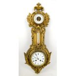 Twin train wall clock barometer, in gilt metal case.