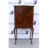 Reproduction mahogany and burr walnut veneered serpentine cabinet on cabriole legs,.