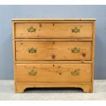 Stripped pine chest of 3 long drawers.