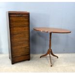 An early 20th century mahogany oval topped occasional table on tripod base, a filing cabinet and