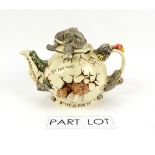 Seven novelty teapots including Paul Cardew Harmony Kingdom, James Sadler and Disney. (7).