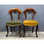 Set of six 19th Century mahogany balloon back dining chairs with padded seats on turned legs .