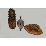 A quantity of tribal masks and artefacts together with assorted vintage clocks. (qty).