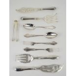 Two pairs of silver-plated fish servers, together with two forks, two spoons and a pair of sugar