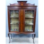 Early 20th century display cabinet, doors inset with stained glass panels .