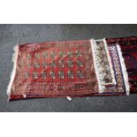 Four Persian design rugs.