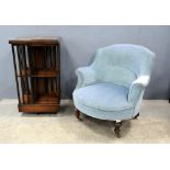 A mahogany and inlaid revolving bookcase and a mahogany framed armchair. (2).