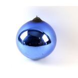 A blue glass witch ball, diameter 18cm aprox.