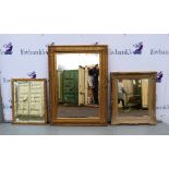 Three gilt framed mirrors .