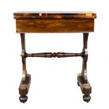Regency rosewood swivel action tea table with a side drawer on twin end supports united by a