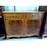 Reproduction yew wood sideboard.