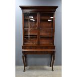 19th century mahogany cabinet above later base with twelve slim drawers on carved cabriole legs,