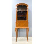 A reproduction mahogany display cabinet with cutlery drawers and a coffer. (2).