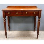 Mahogany side table with two drawers on turned legs..