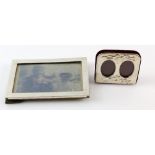 Two silver-mounted photograph frames, one a double portrait frame, the larger 11 x 16 cm (2).