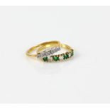 1960's diamond ring, set with five Swiss cut diamonds, and emerald and diamond ring, both mounted in