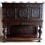 Oak cupboard on stand made from antique parts .