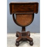 19th century flame mahogany drop leaf work table.