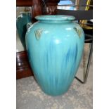 Blue glazed pot with scroll handles 63cm.