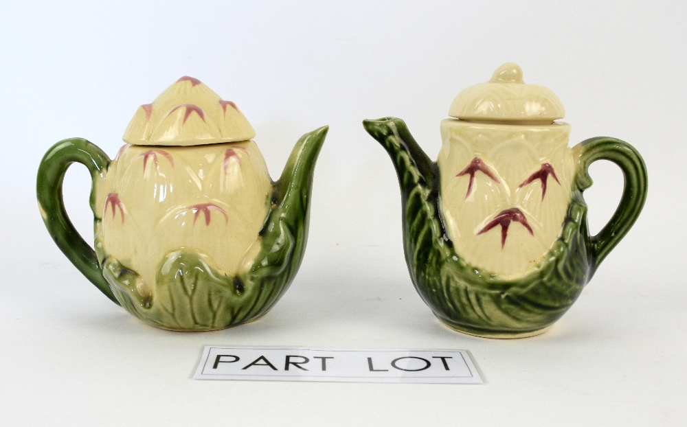 A quantity of novelty teapots including Crown Staffordshire and The Village Teapot Collectables. (