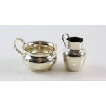 Two silver cream jugs, one of squat circular form 7 cm diam, the other 7 cm high, 84 gr. (2).