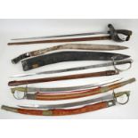 Five swords including a Chinese style sword in carved wooden scabbard, African style machete in