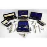 Collection of mid-20th century scientific instruments, including cased diagnostic sets, ear