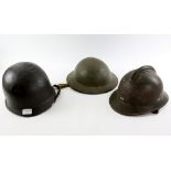 WWI French Adrian helmet and two other helmets