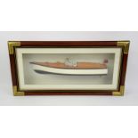 A half hull model of a motor boat, in glazed presentation case.