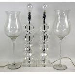 A pair of contemporary glass table lamps and pair of glass candle holders